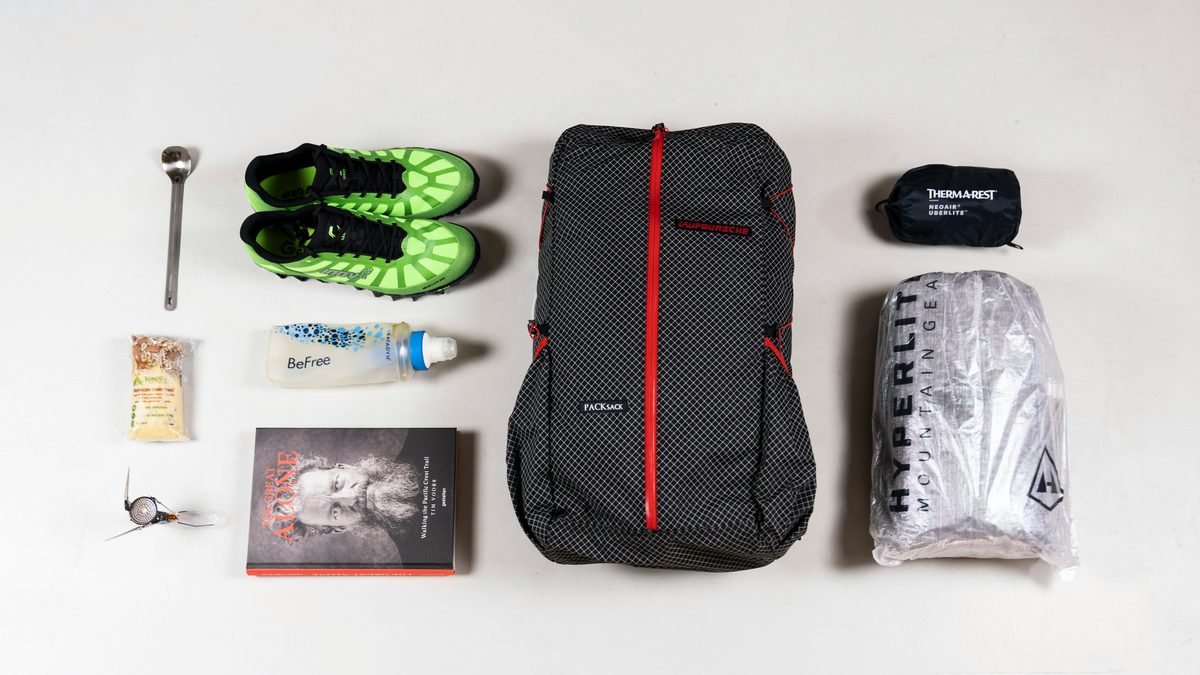 Emergency supplies and a packed bag laid out on a table