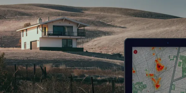 A map showing the wildfire vulnerability score for an address with a modern house in dry grassland.