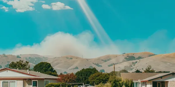 Wildfire smoke behind a Northern California home, a reminder to create a custom action plan.
